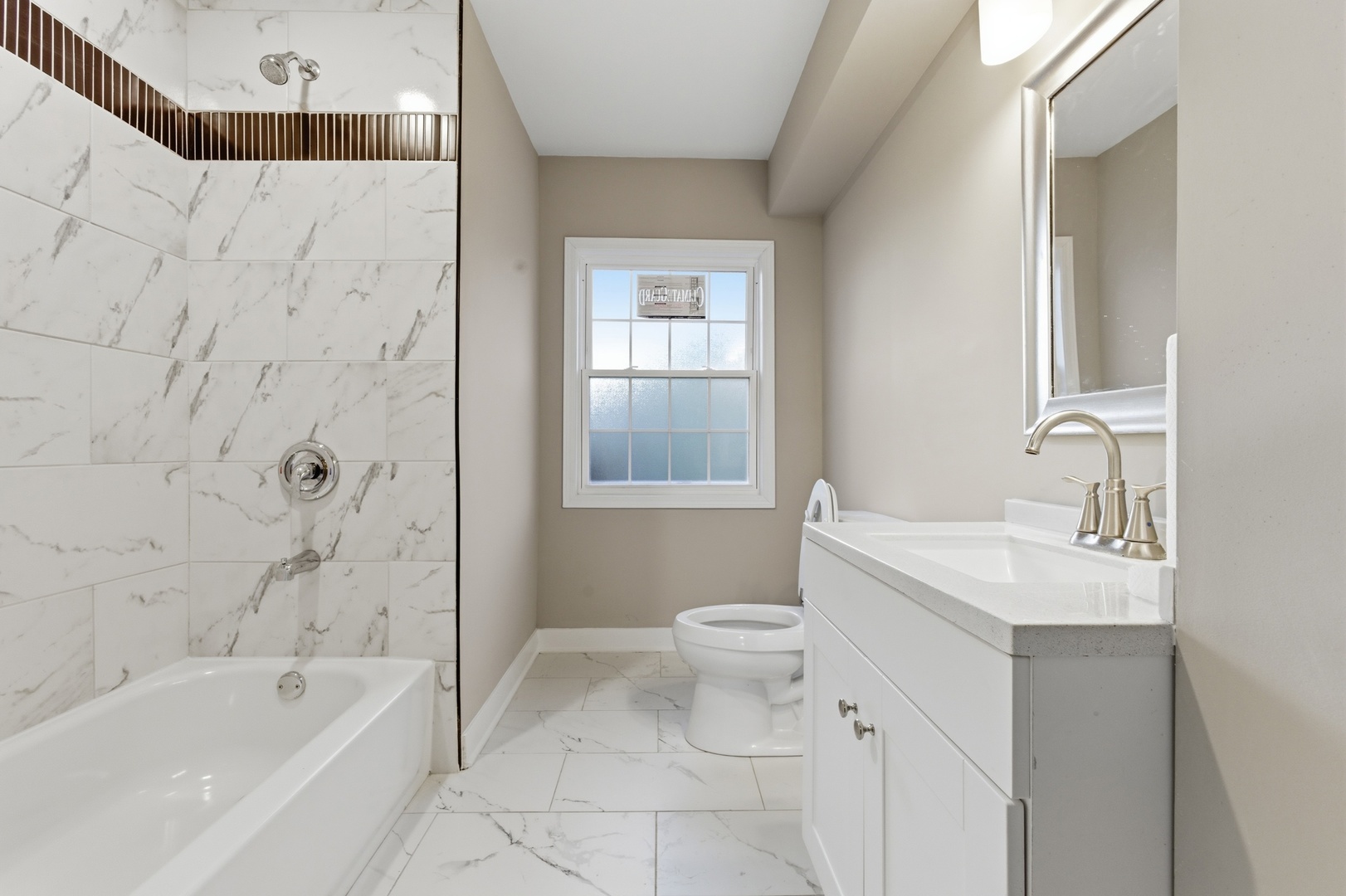 521 Fitch Road Rockford, IL 61109 - Photo 7 of 10 a bathroom with a sink a toilet and bathtub