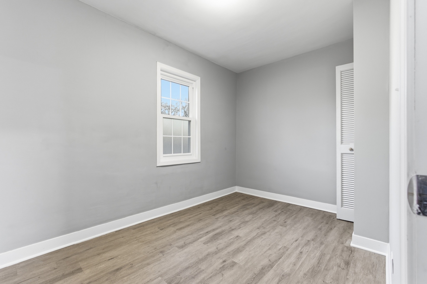 521 Fitch Road Rockford, IL 61109 - Photo 9 of 10 a view of a room that has wooden floor and window