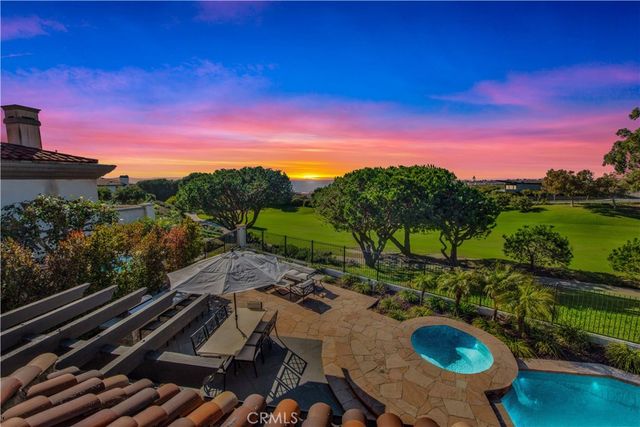 a view of a house with swimming pool yard fire pit and outdoor seating