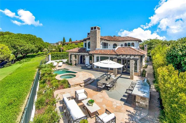 a living room with furniture and view of kitchen
