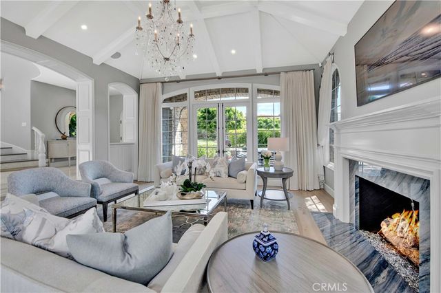 a view of swimming pool with outdoor seating and a potted plant