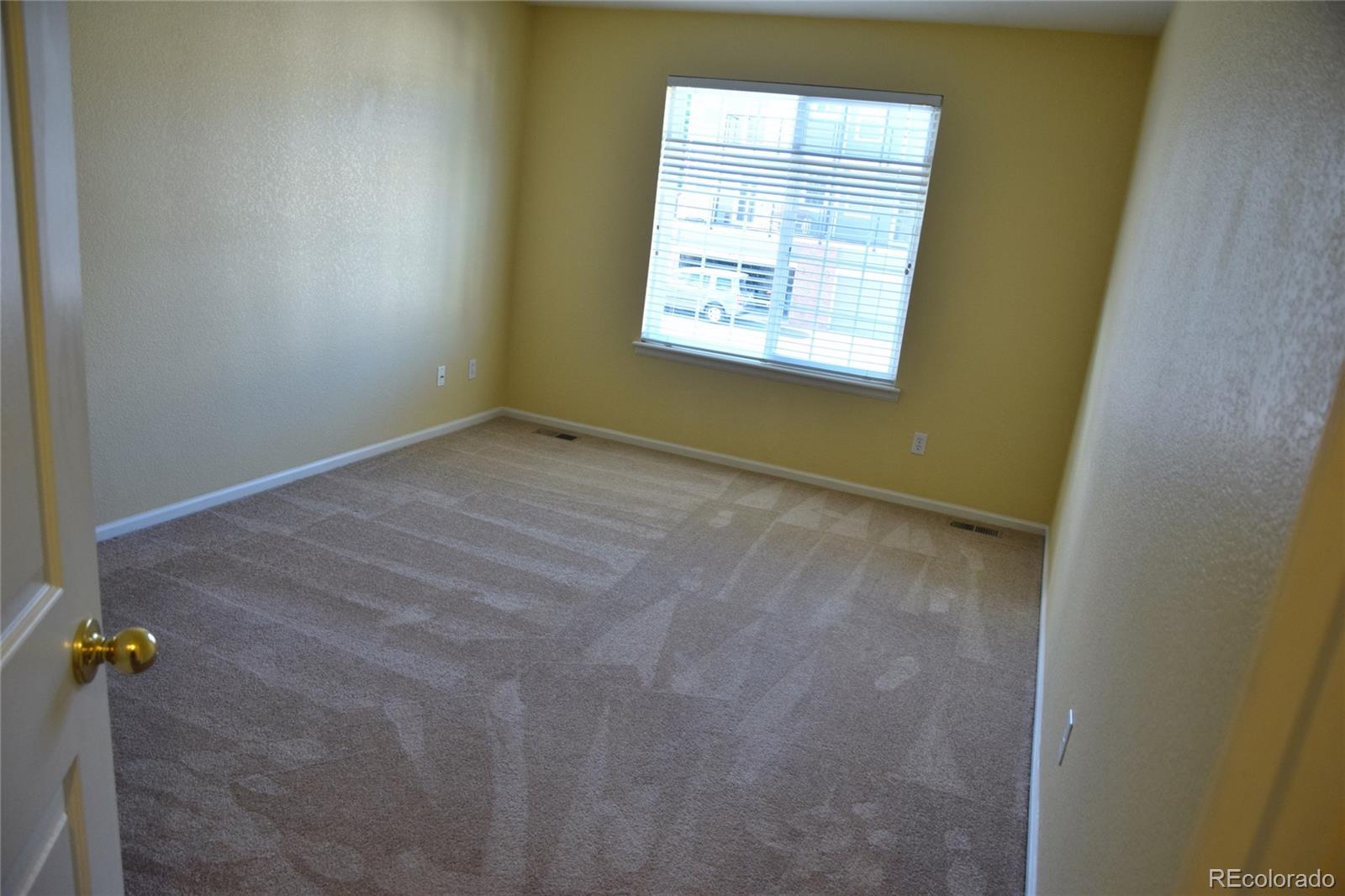 8237 West 54th Avenue, Unit 2 Arvada, CO 80002 - Photo 15 of 20 an empty room with a window