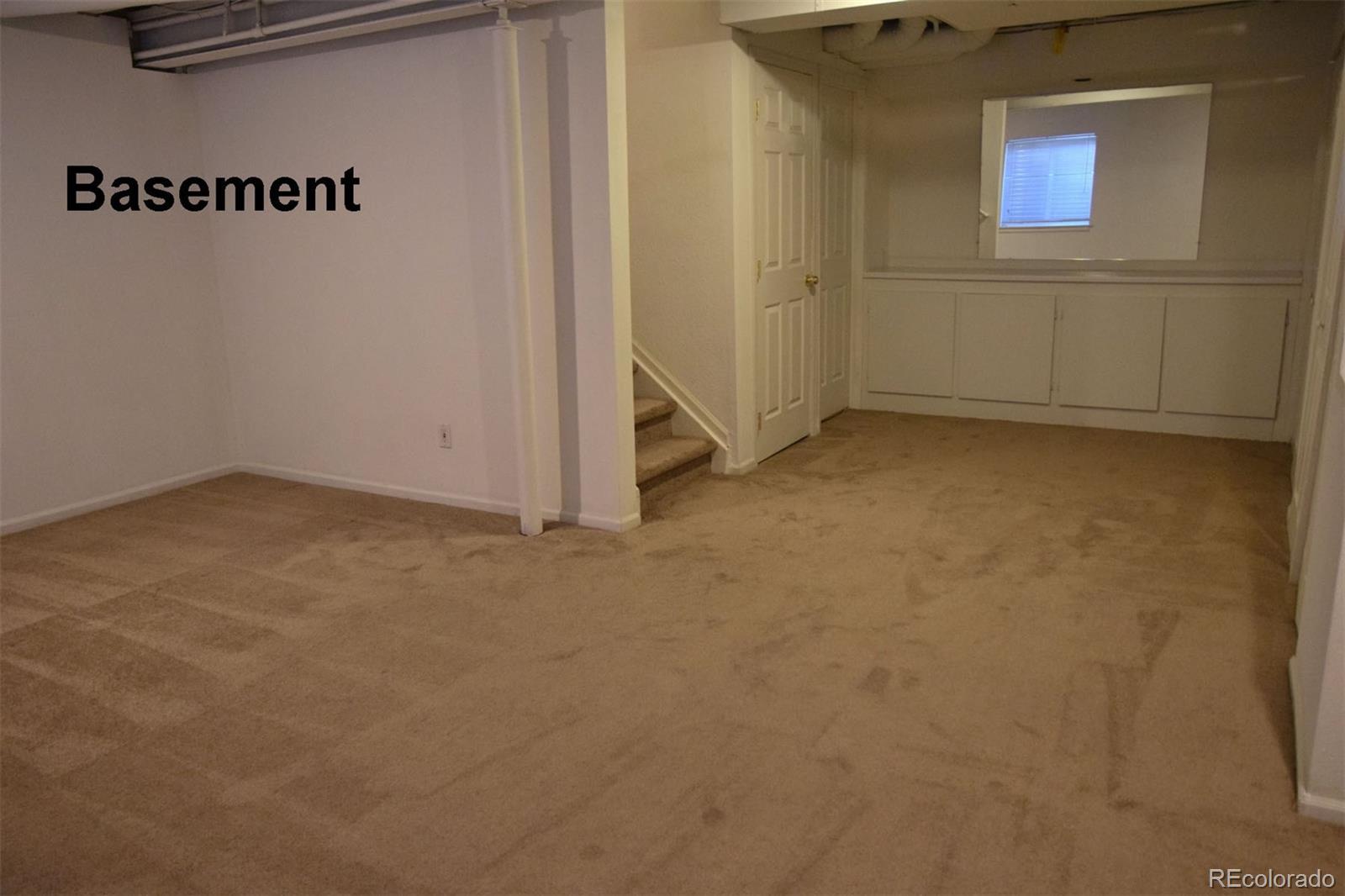 8237 West 54th Avenue, Unit 2 Arvada, CO 80002 - Photo 17 of 20 a view of a room with rack on the wall