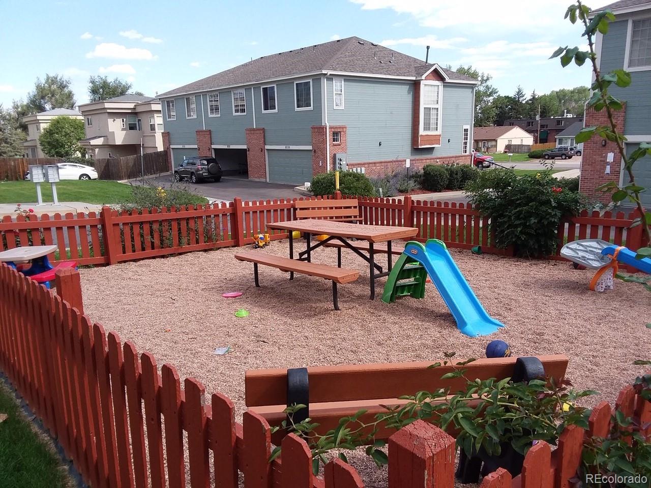 8237 West 54th Avenue, Unit 2 Arvada, CO 80002 - Photo 19 of 20 a view of a house with backyard and sitting area