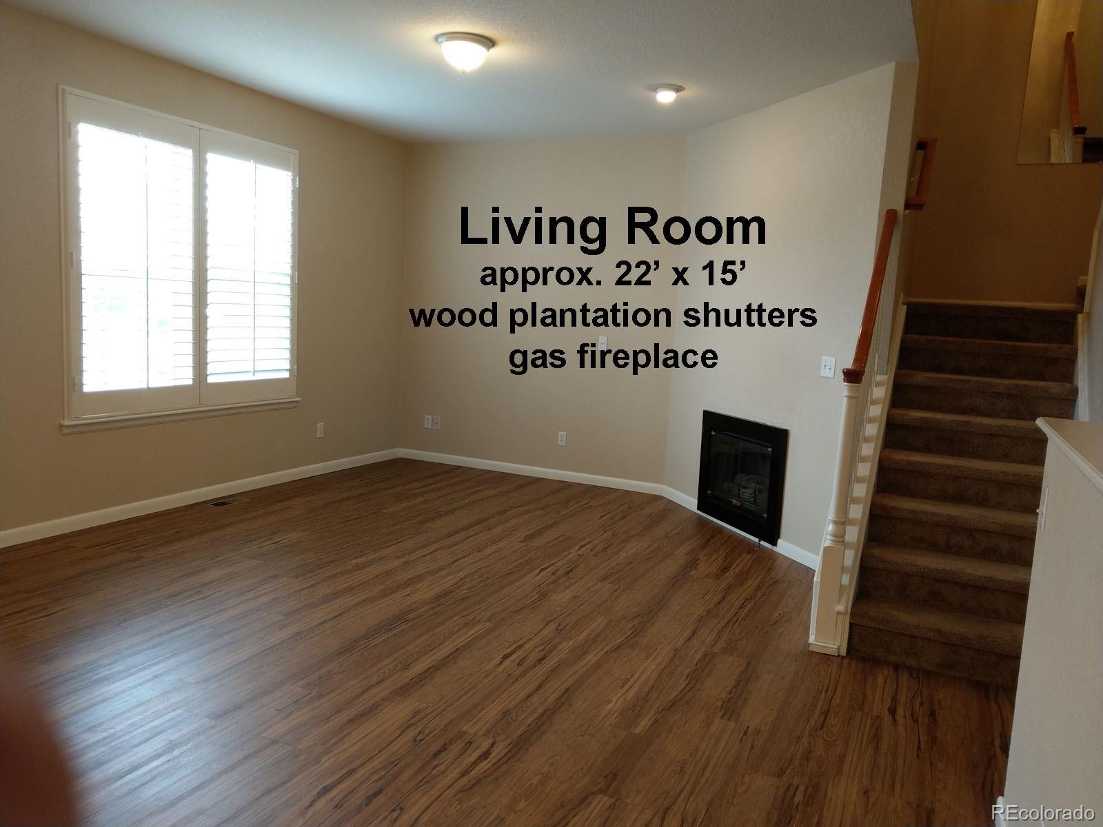 8237 West 54th Avenue, Unit 2 Arvada, CO 80002 - Photo 3 of 20 an entryway of a house with wooden floor