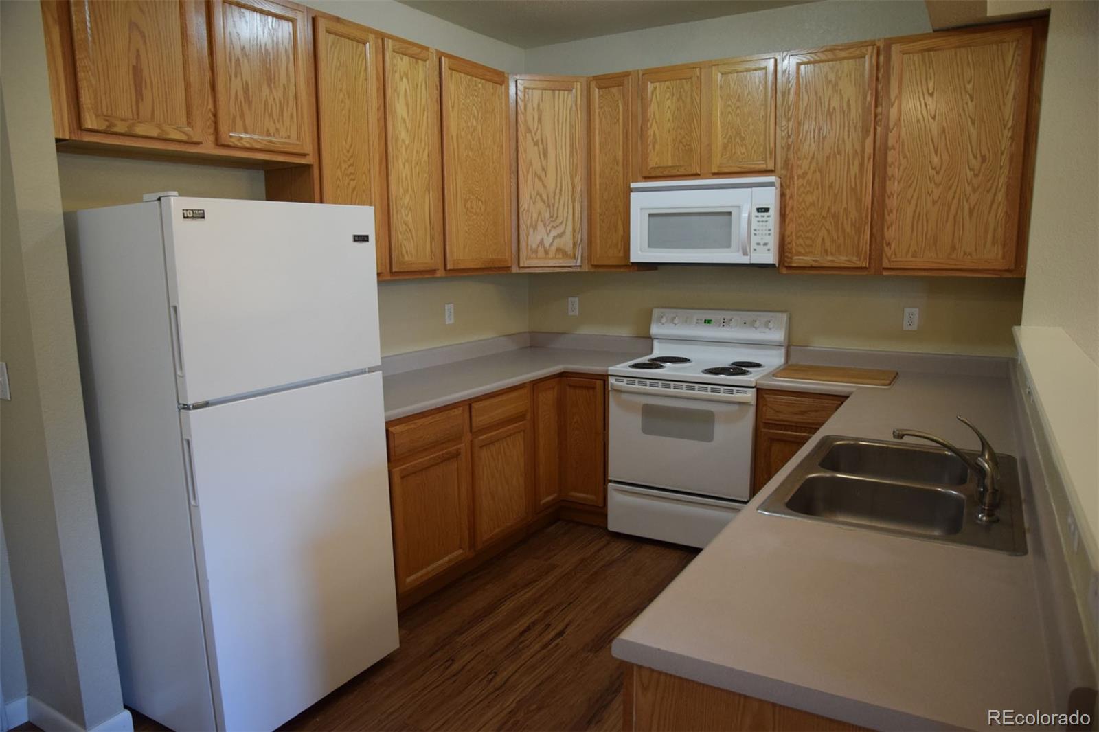 8237 West 54th Avenue, Unit 2 Arvada, CO 80002 - Photo 4 of 20 a utility room with wooden floor washer and dryer