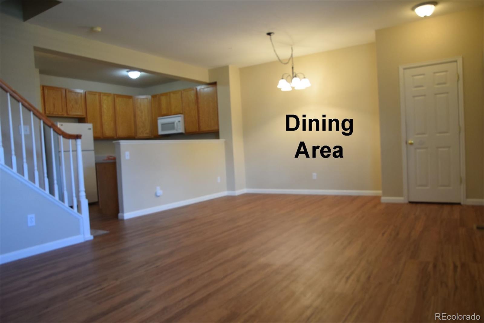 8237 West 54th Avenue, Unit 2 Arvada, CO 80002 - Photo 5 of 20 a view of an empty room with stairs and ventilation