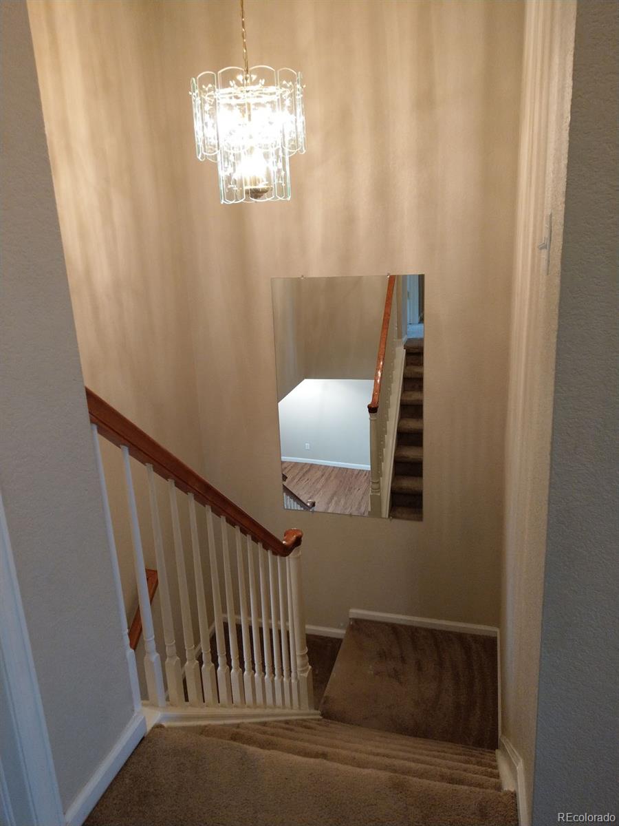 8237 West 54th Avenue, Unit 2 Arvada, CO 80002 - Photo 7 of 20 a view of entryway and hall with wooden floor