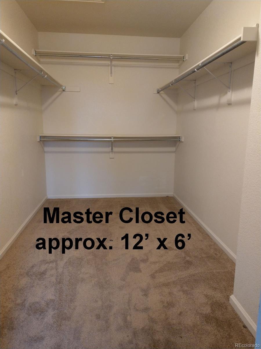 8237 West 54th Avenue, Unit 2 Arvada, CO 80002 - Photo 9 of 20 a white cabinet with white and black and white walls