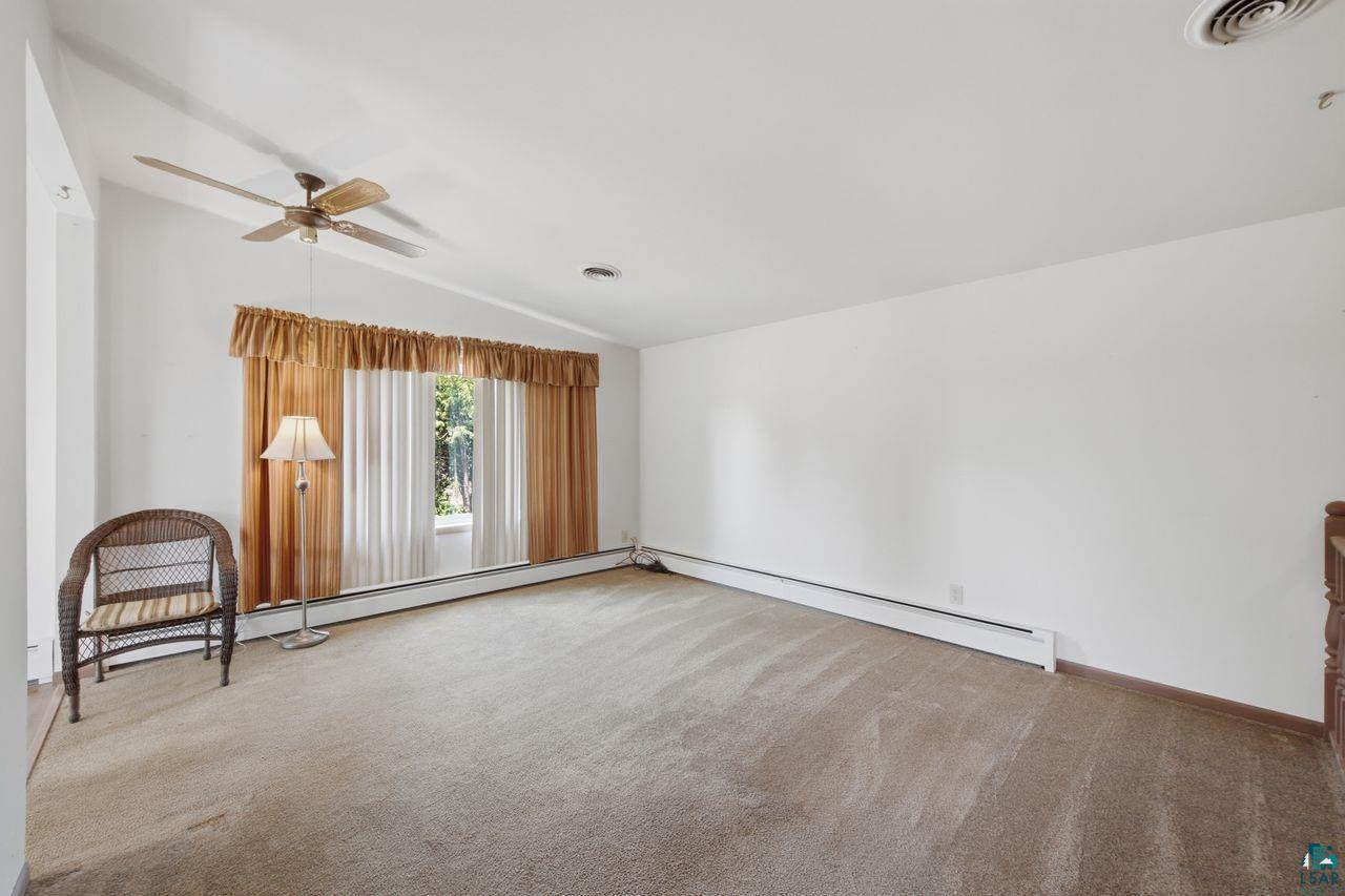 61018 Dahlstrom Road Ashland, WI 54806 - Photo 6 of 28 Spacious interior room with light-toned carpeting and white walls