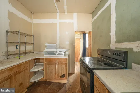 a kitchen with a stove and a sink