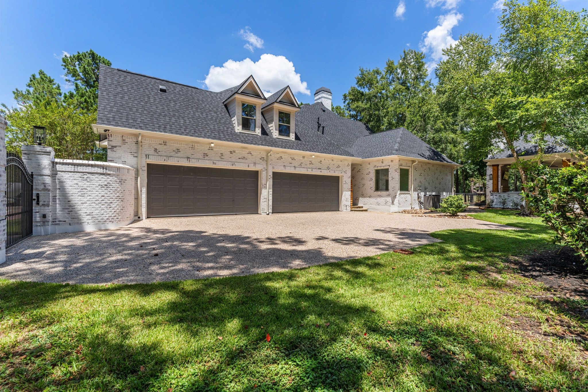 31 Hollymead Drive Spring, TX 77381 - Photo 47 of 50 This home features an oversized driveway inside the rod iron driveway gate and a full four-car garage. The property is located at the end of a cul-de-sac street that dead ends into the golf course. Amazing location.