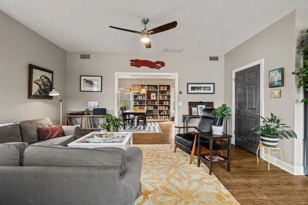 a kitchen with granite countertop white cabinets and stainless steel appliances