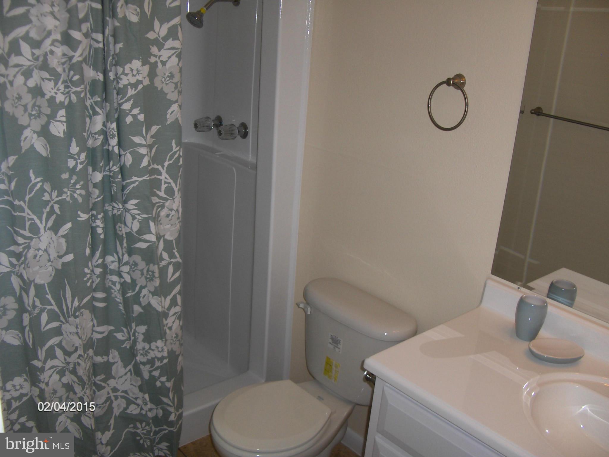 14502 Fiske Drive, Unit 138B Silver Spring, MD 20906 - Photo 11 of 21 a bathroom with a toilet and shower