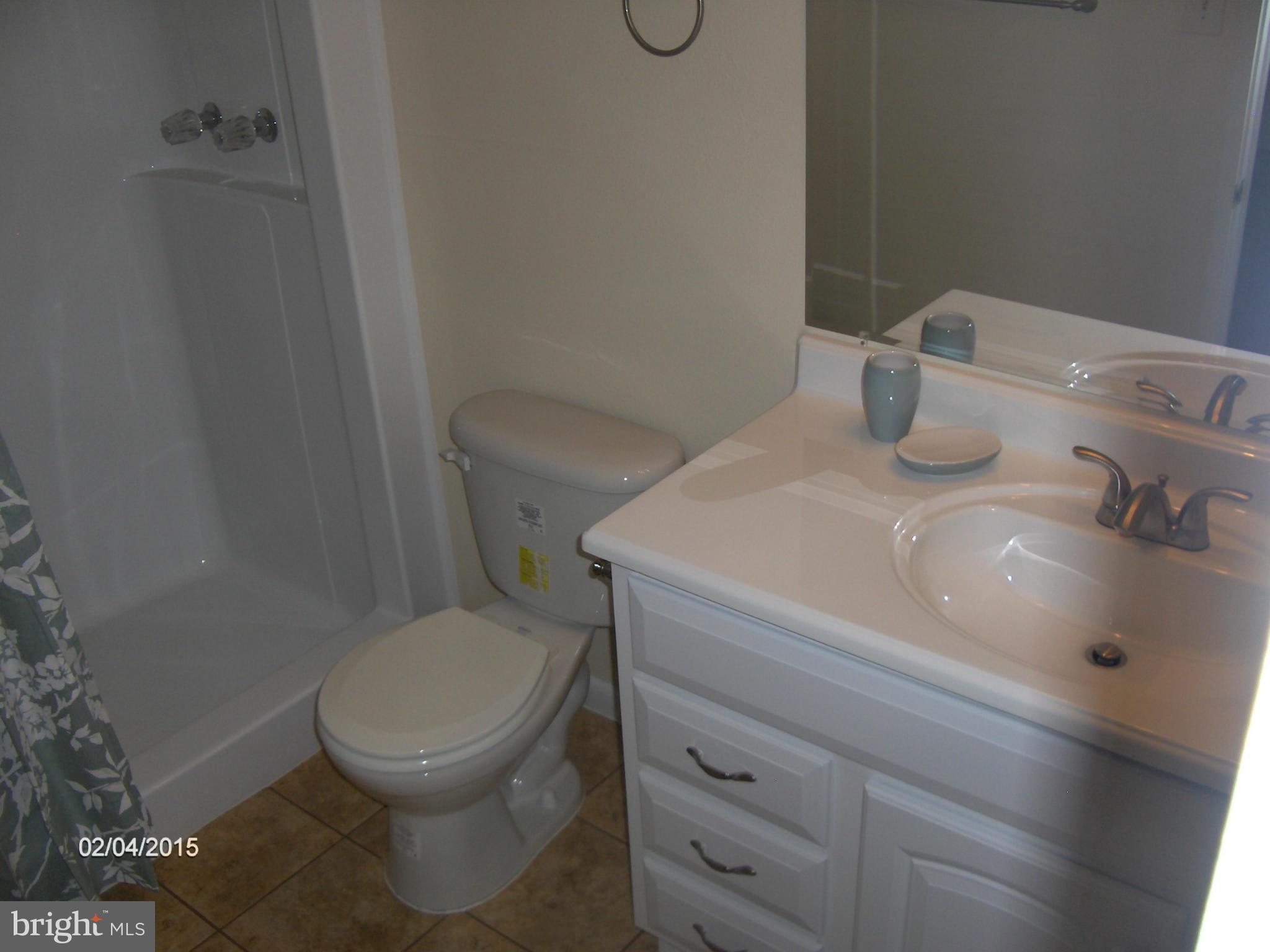 14502 Fiske Drive, Unit 138B Silver Spring, MD 20906 - Photo 12 of 21 a bathroom with a toilet and a sink