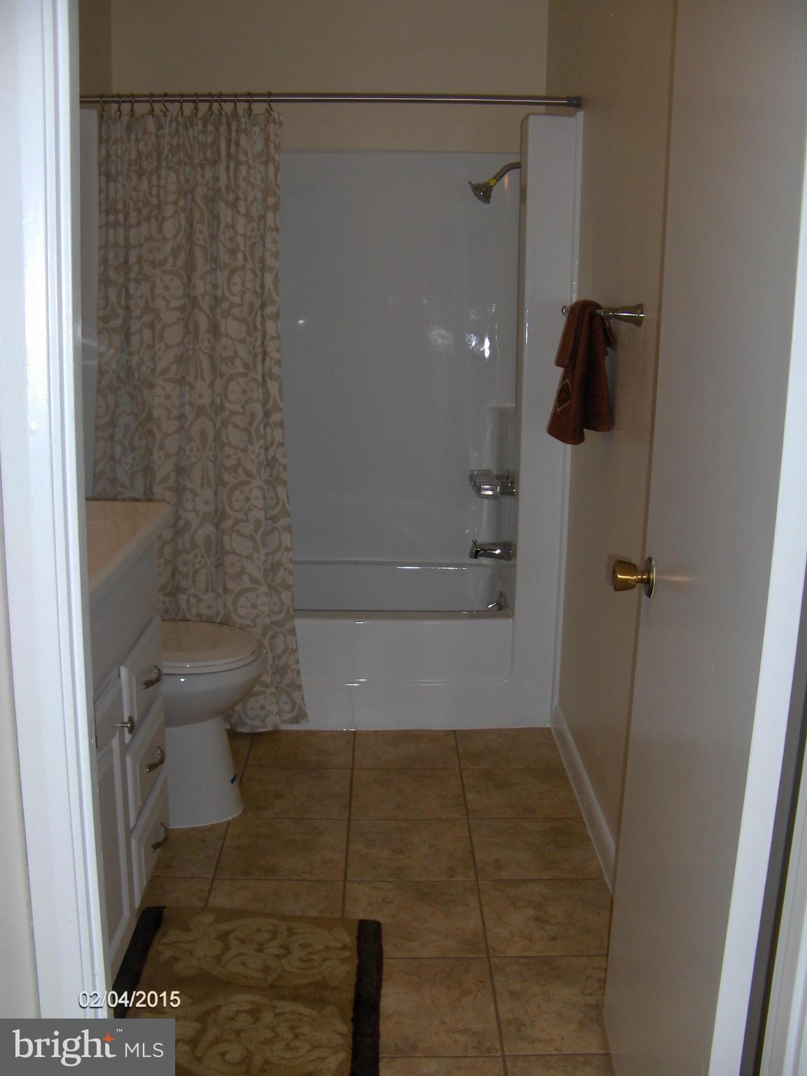14502 Fiske Drive, Unit 138B Silver Spring, MD 20906 - Photo 17 of 21 a bathroom with a shower and toilet