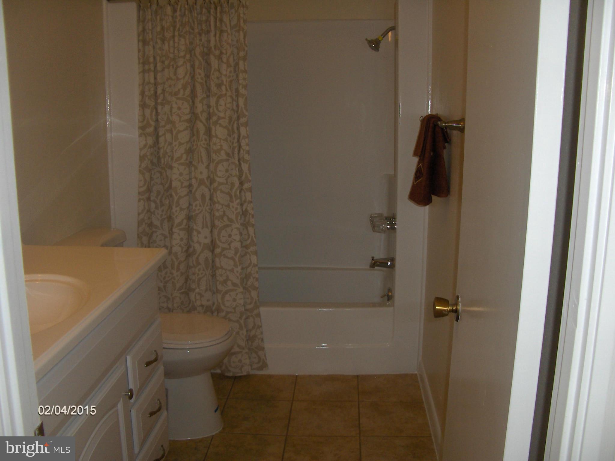 14502 Fiske Drive, Unit 138B Silver Spring, MD 20906 - Photo 18 of 21 a bathroom with a toilet and a bathtub