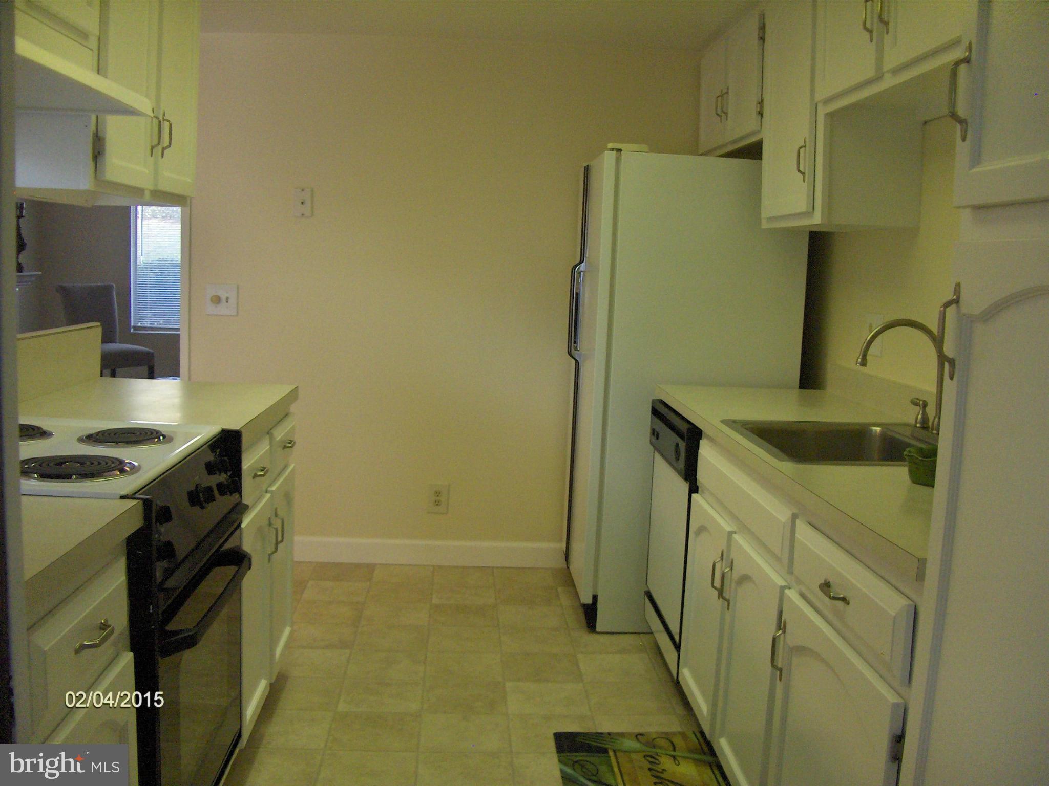 14502 Fiske Drive, Unit 138B Silver Spring, MD 20906 - Photo 8 of 21 a bathroom with a sink and a washing machine