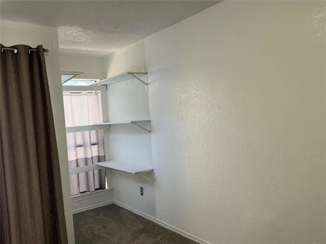 a view of walk in closet with window