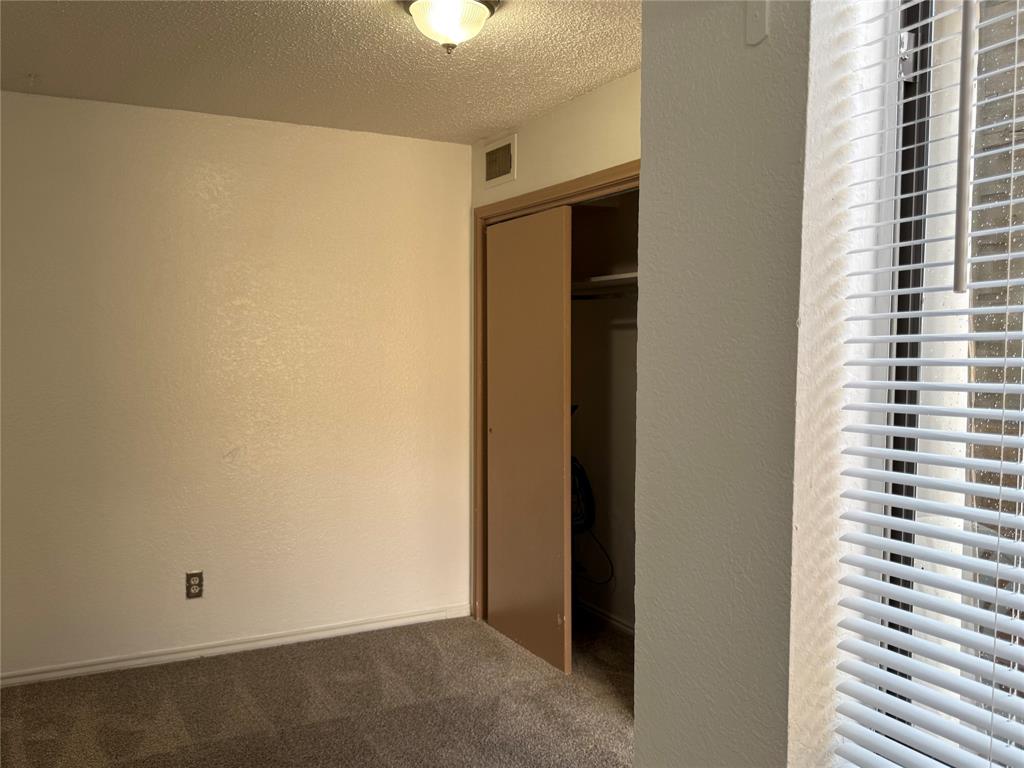 9803 Walnut Street, Unit 308 Dallas, TX 75243 - Photo 14 of 22 a view of a room with a window