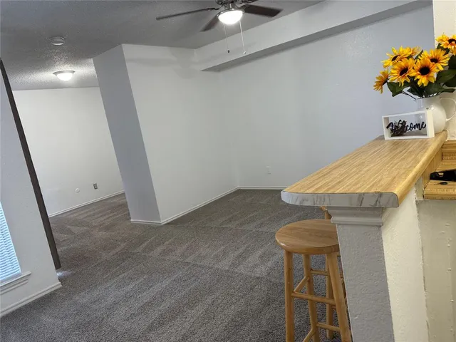 a room with a table and a chandelier