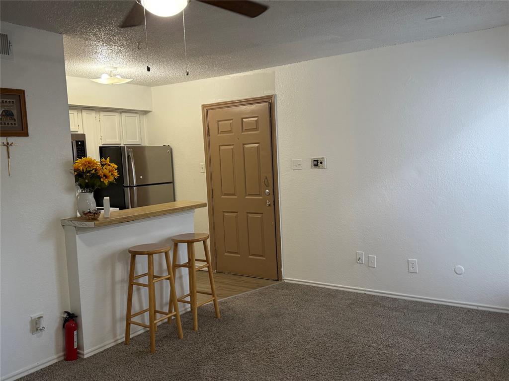 9803 Walnut Street, Unit 308 Dallas, TX 75243 - Photo 6 of 22 a room with a table and chairs