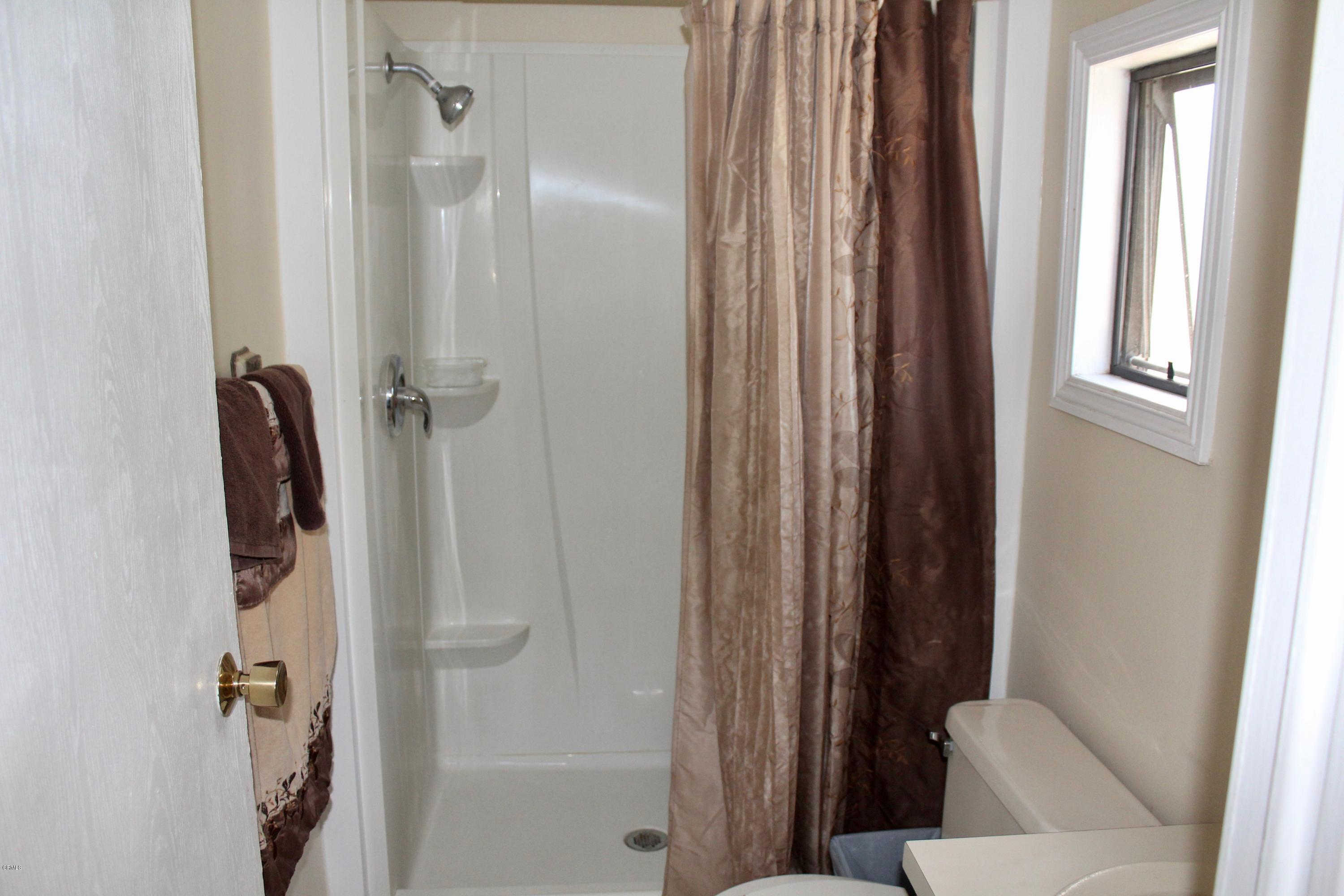 4145 Serena Lane, Unit 21 Oxnard, CA 93033 - Photo 10 of 16 a bathroom with a shower