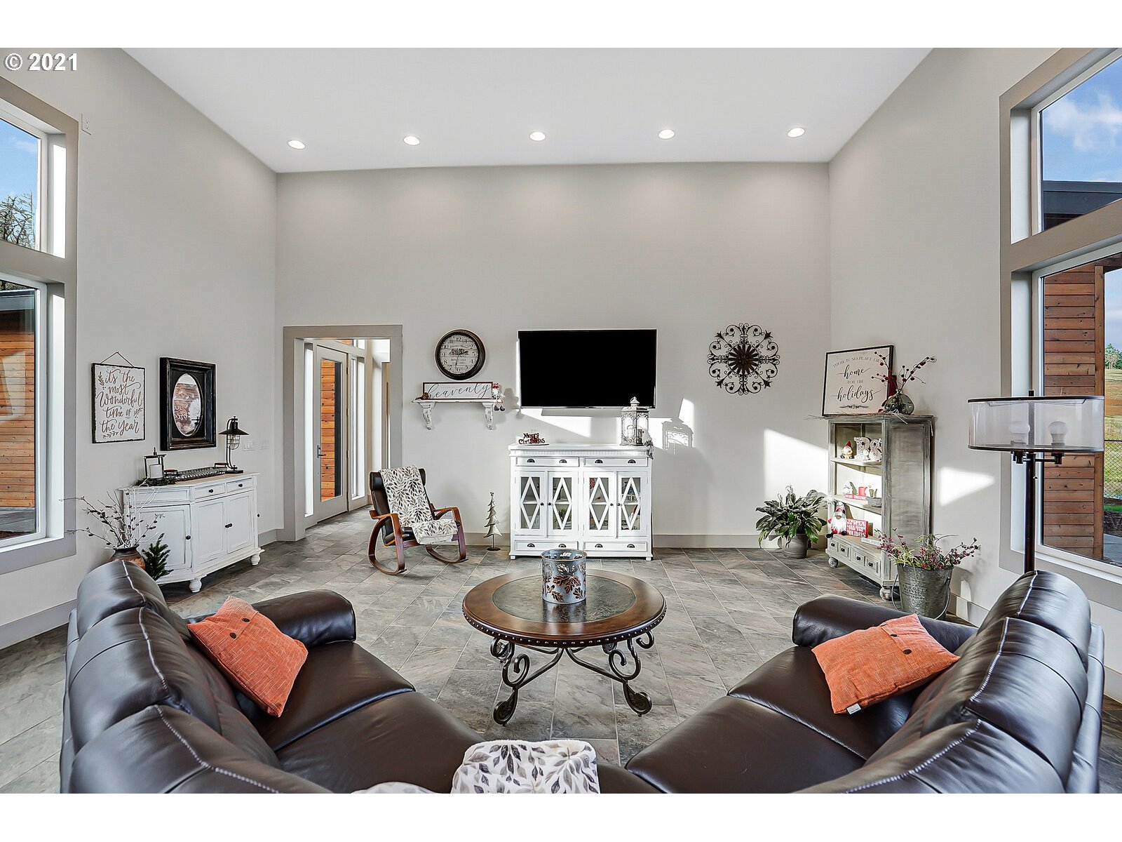 22280 Pittman Road Sheridan, OR 97378 - Photo 11 of 32 a living room with furniture a flat screen tv and kitchen view