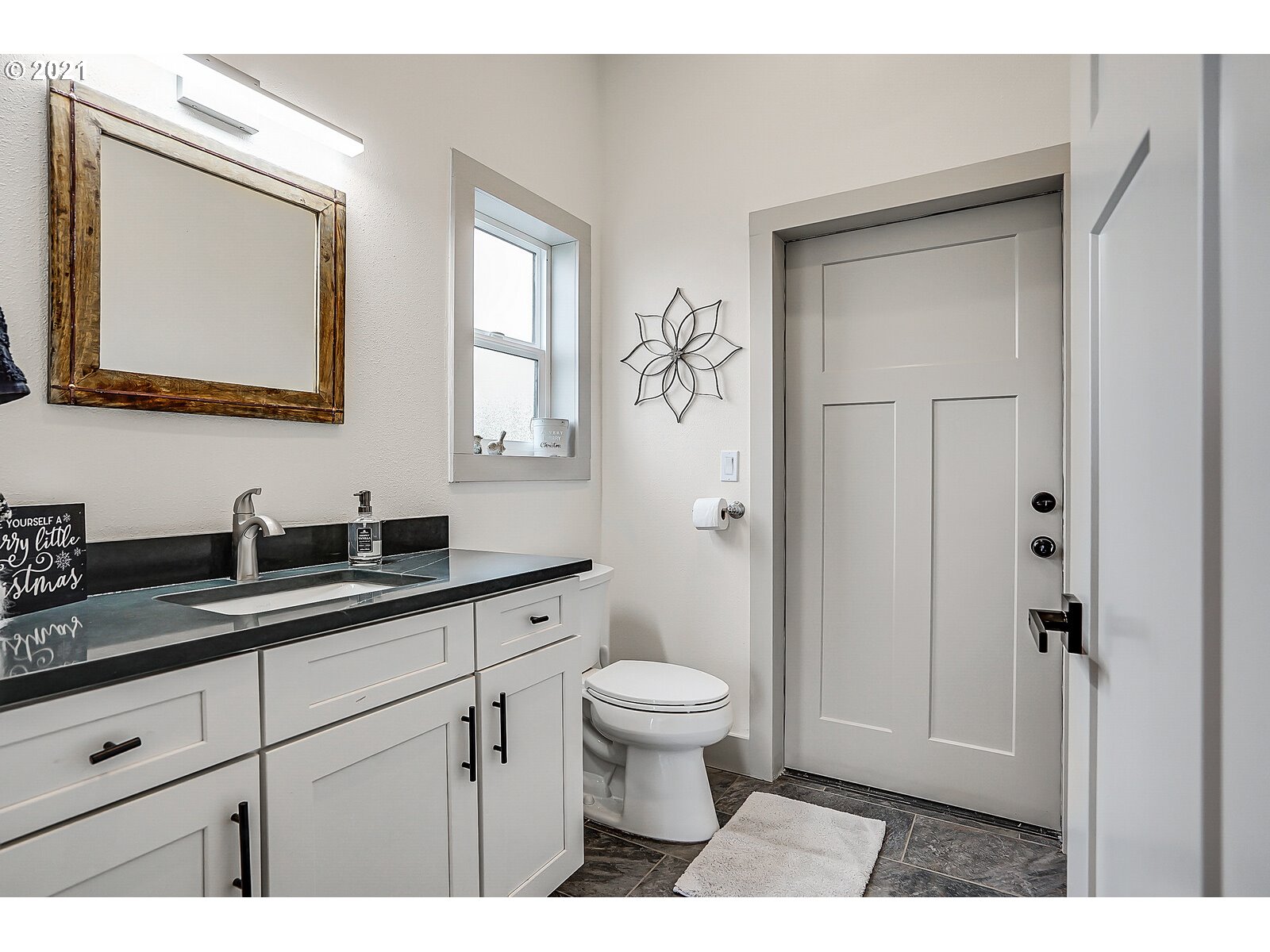 22280 Pittman Road Sheridan, OR 97378 - Photo 14 of 32 a bathroom with a granite countertop sink mirror and toilet