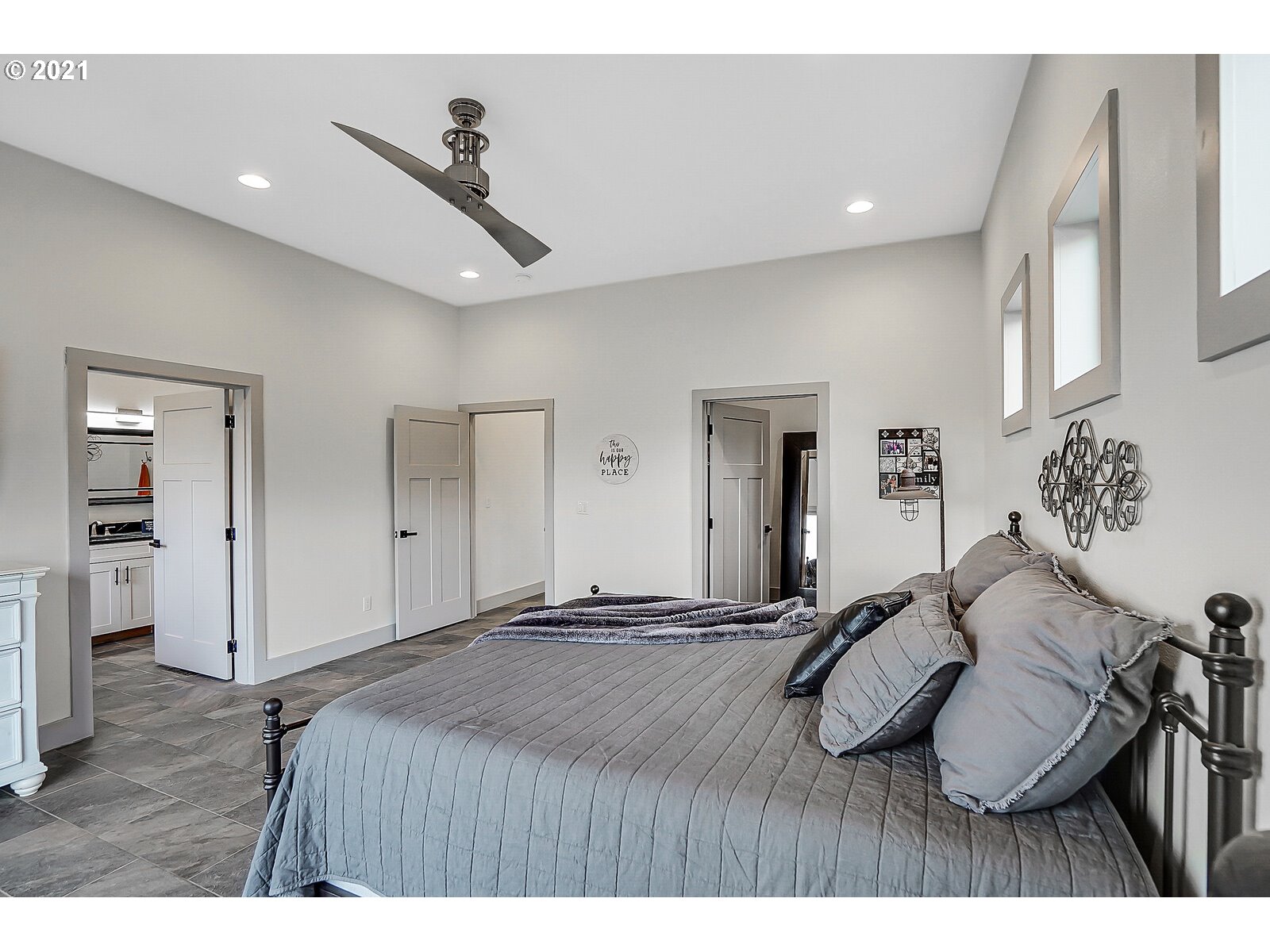 22280 Pittman Road Sheridan, OR 97378 - Photo 16 of 32 a bedroom with a bed and wooden floor