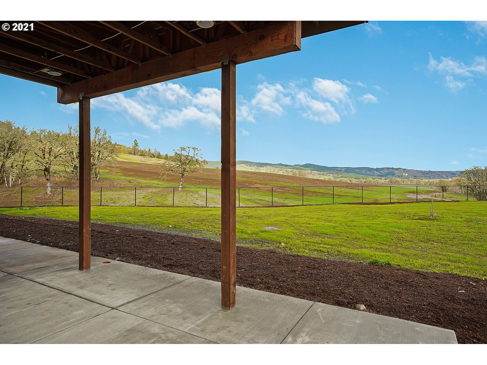 22280 Pittman Road Sheridan, OR 97378 - Photo 25 of 32 a view of a room with floor to ceiling windows yard with ocean view