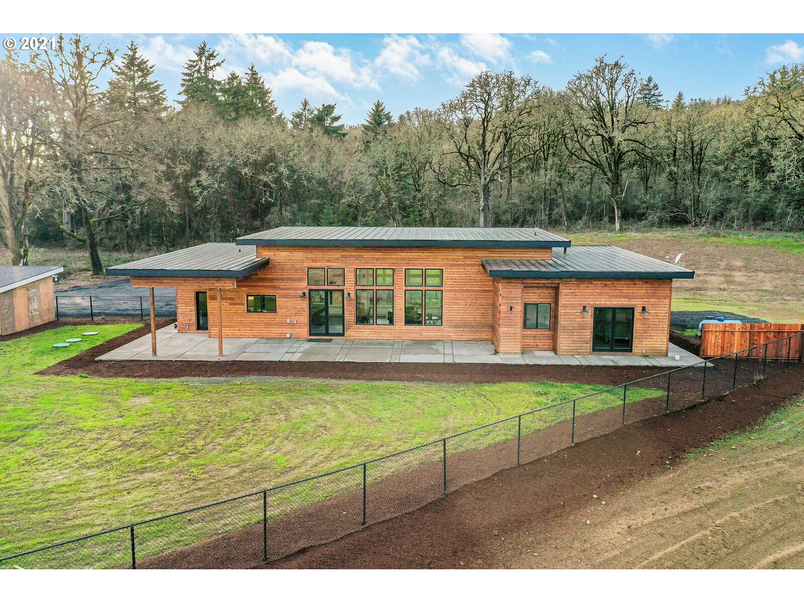 22280 Pittman Road Sheridan, OR 97378 - Photo 28 of 32 a view of a house with backyard sitting area and backyard