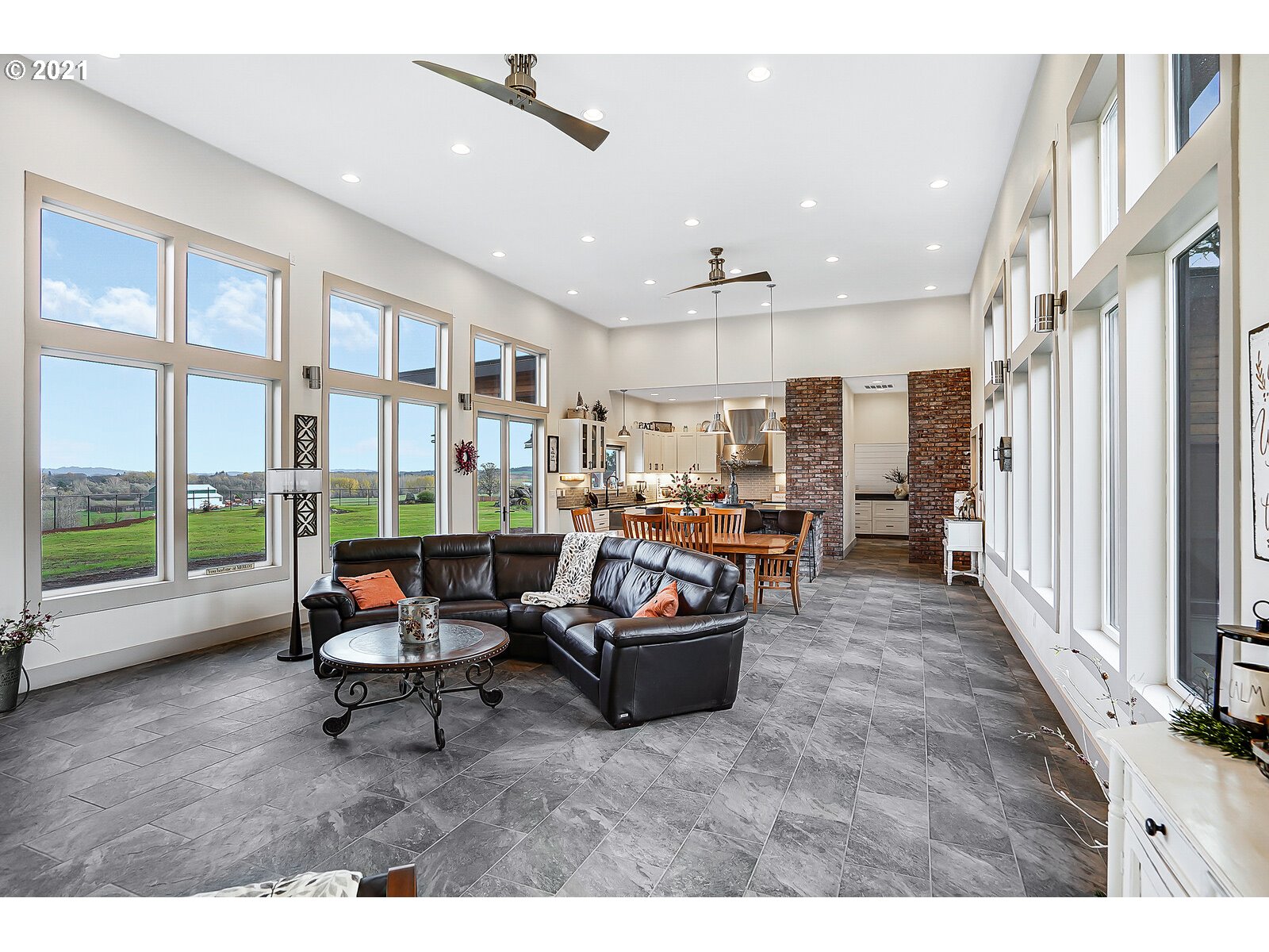 22280 Pittman Road Sheridan, OR 97378 - Photo 3 of 32 a living room with furniture and a floor to ceiling window