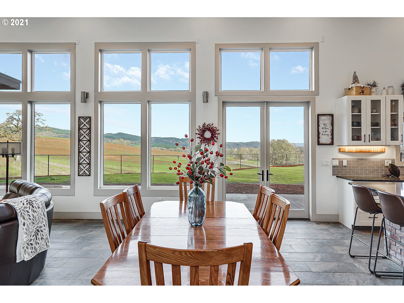 22280 Pittman Road Sheridan, OR 97378 - Photo 5 of 32 a dining room with furniture large windows and wooden floor