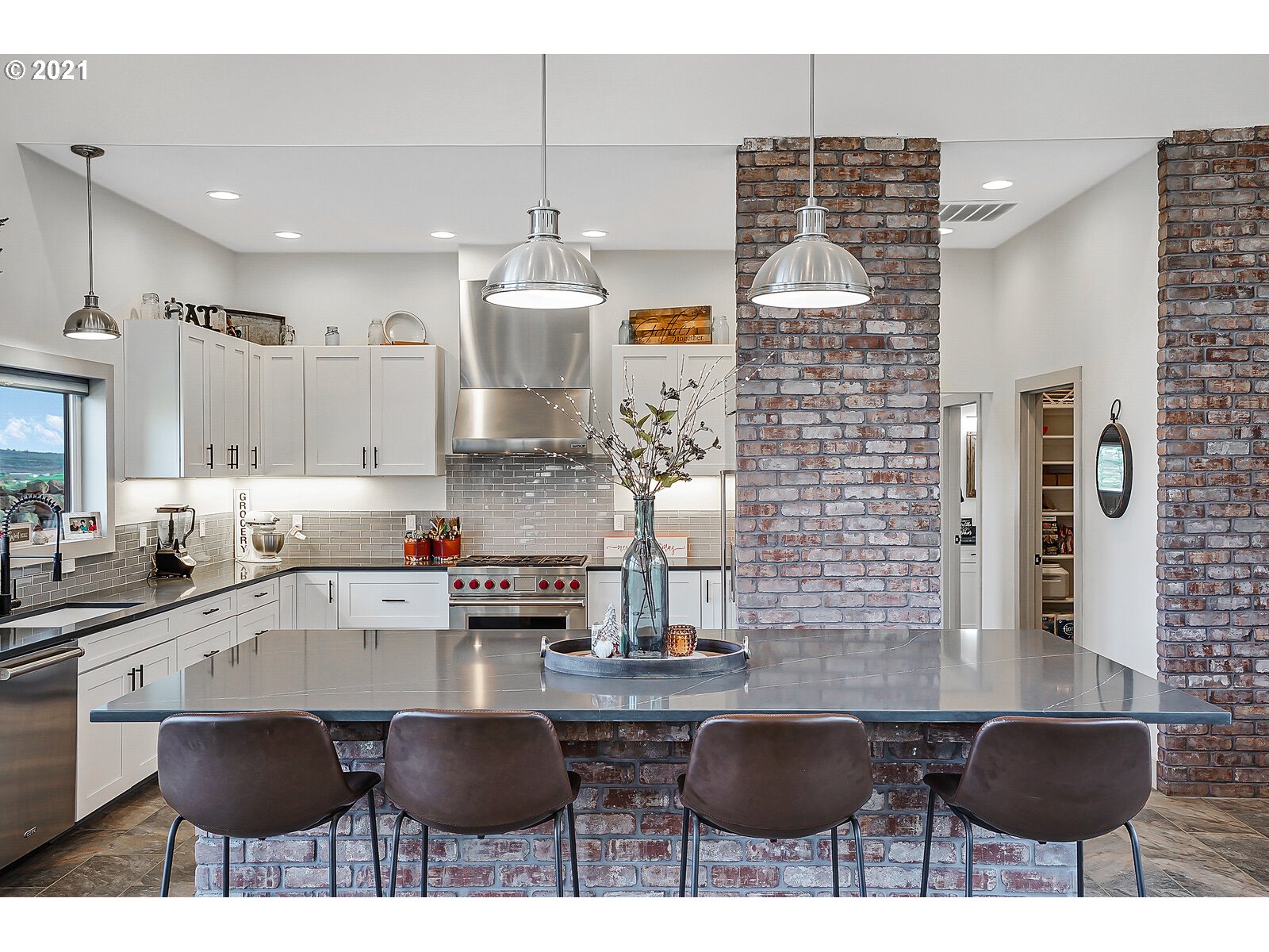 22280 Pittman Road Sheridan, OR 97378 - Photo 6 of 32 a kitchen with stainless steel appliances kitchen island granite countertop a sink and cabinets