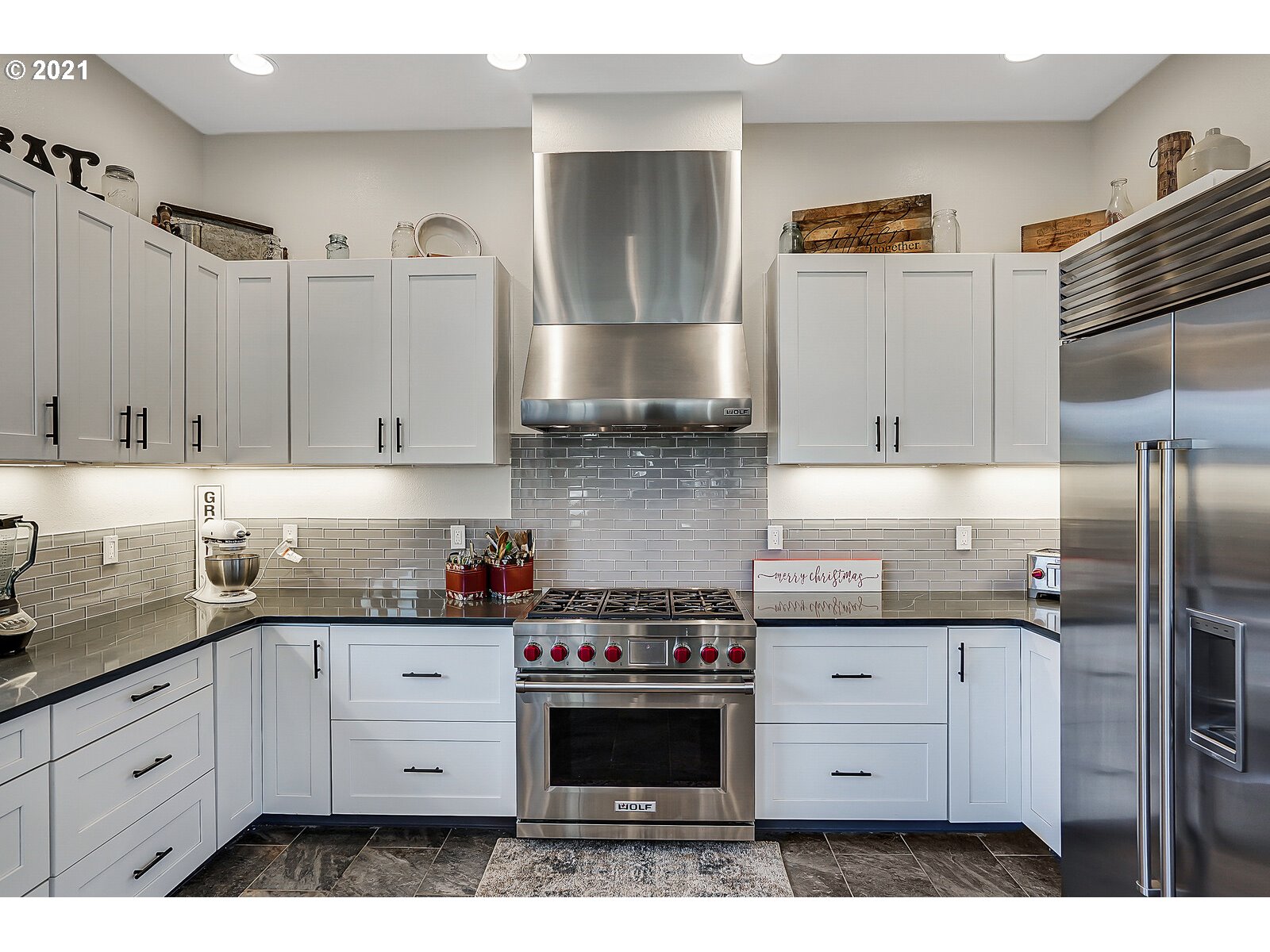 22280 Pittman Road Sheridan, OR 97378 - Photo 8 of 32 a kitchen with granite countertop a stove a sink and cabinets