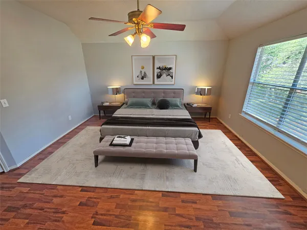 a bedroom with a bed and a chandelier