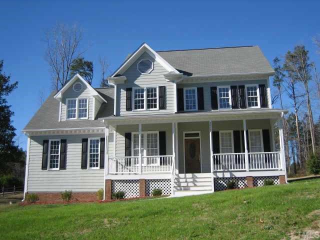 5479 Pearces Road Louisburg, NC 27549 - Photo 1 of 10 Fresh paint on Hardiplank siding, new gutters & downspouts. Southern style rocking chair front porch!