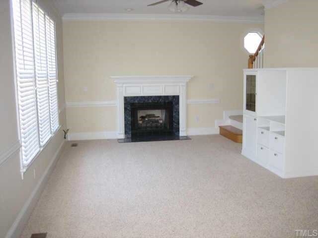 5479 Pearces Road Louisburg, NC 27549 - Photo 4 of 10 New CA berber carpet in family room/open to kitchen. Check out the windows to a gorgeous view!