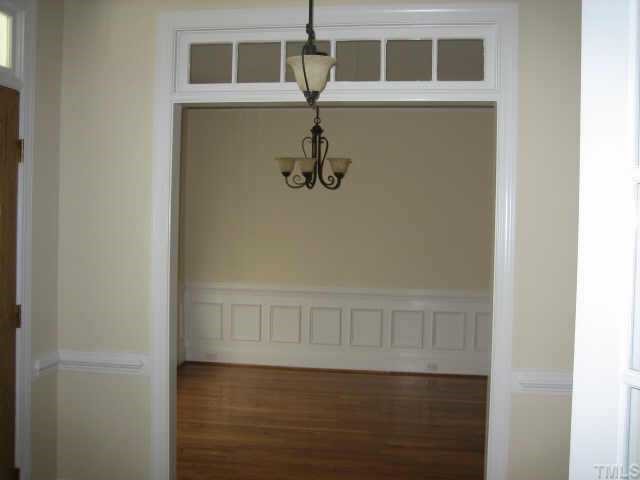 5479 Pearces Road Louisburg, NC 27549 - Photo 7 of 10 A formal living room/office, boasting hardwoods, french doors and transoms. Oh just beautiful