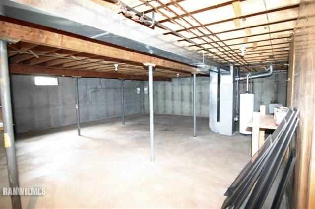 6680 North Point Road Rockford, IL 61108 - Photo 12 of 12 a view of an empty room with wooden floor