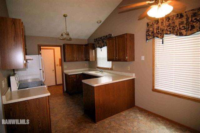 6680 North Point Road Rockford, IL 61108 - Photo 2 of 12 a kitchen with stainless steel appliances granite countertop a sink a stove and a wooden floors