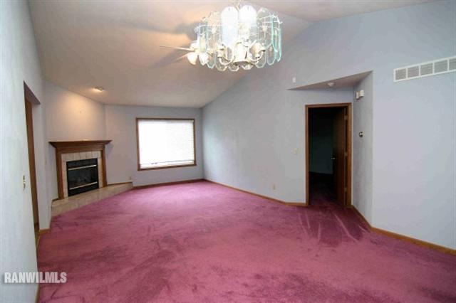 6680 North Point Road Rockford, IL 61108 - Photo 5 of 12 wooden floor and windows in an empty room