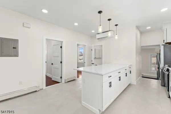 a view of a bedroom with washer and dryer