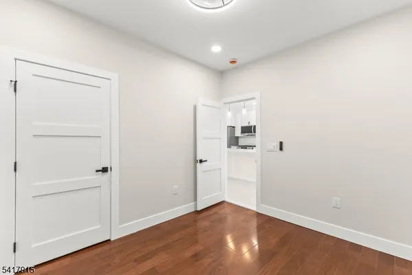 an empty room with wooden floor