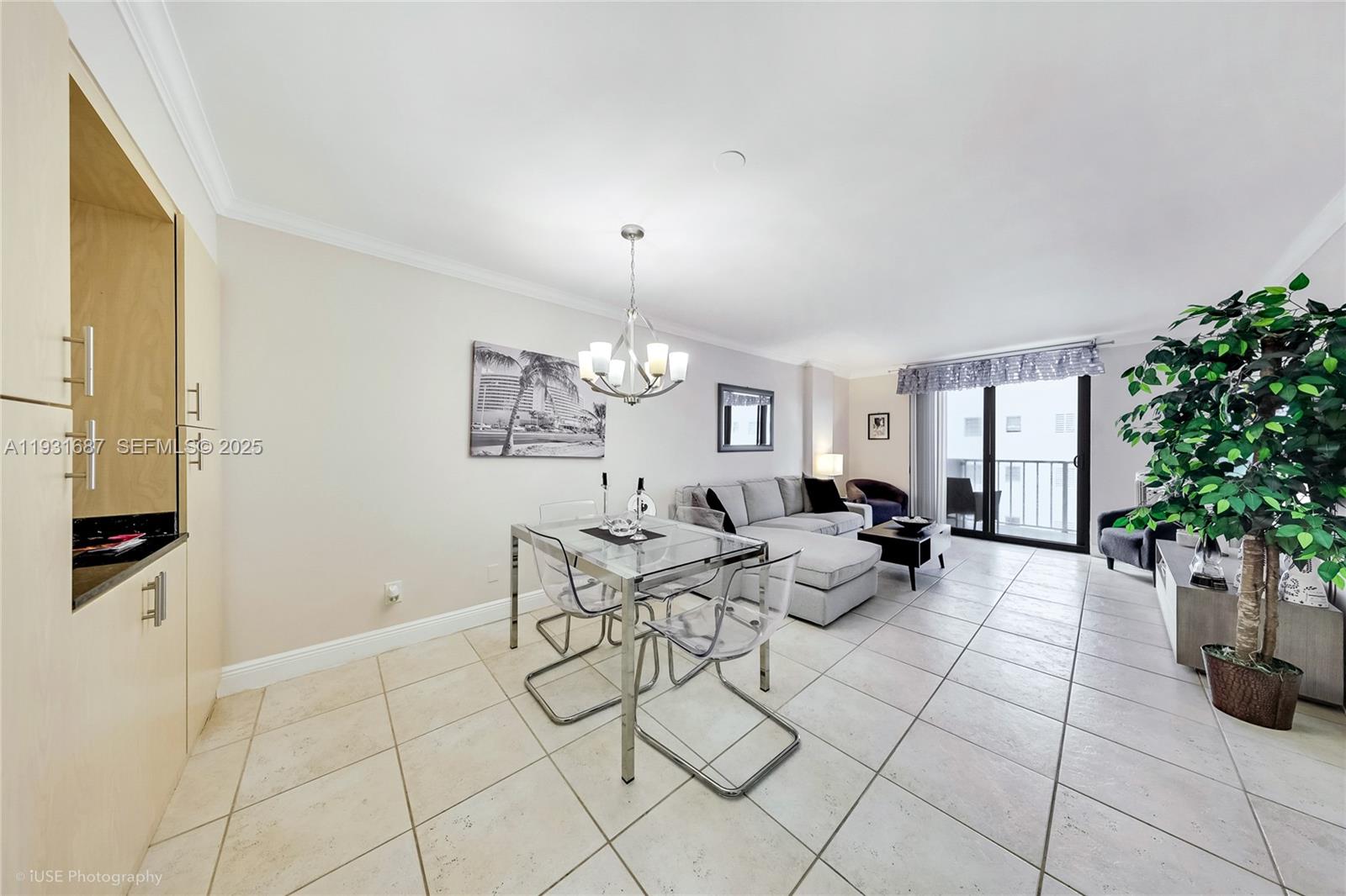 4301 Collins Avenue, Unit 803 Miami Beach, FL 33140 - Photo 12 of 25 a living room with patio furniture and a potted plant