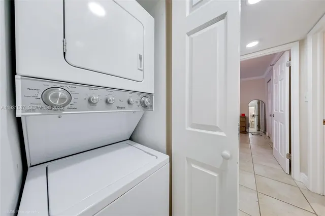 a bathroom with a granite countertop sink a toilet a mirror and shower