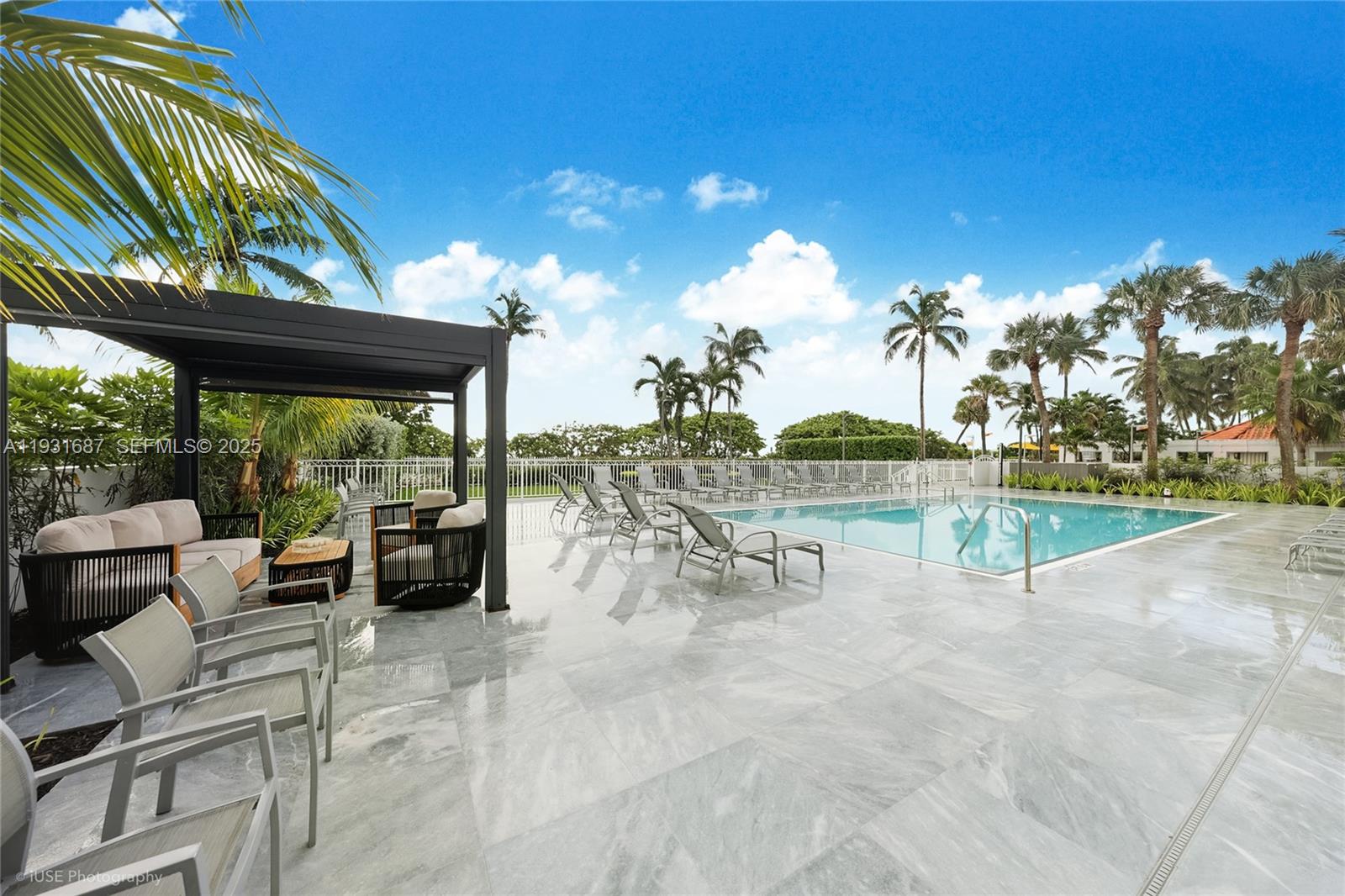 4301 Collins Avenue, Unit 803 Miami Beach, FL 33140 - Photo 23 of 25 a view of a swimming pool with a patio