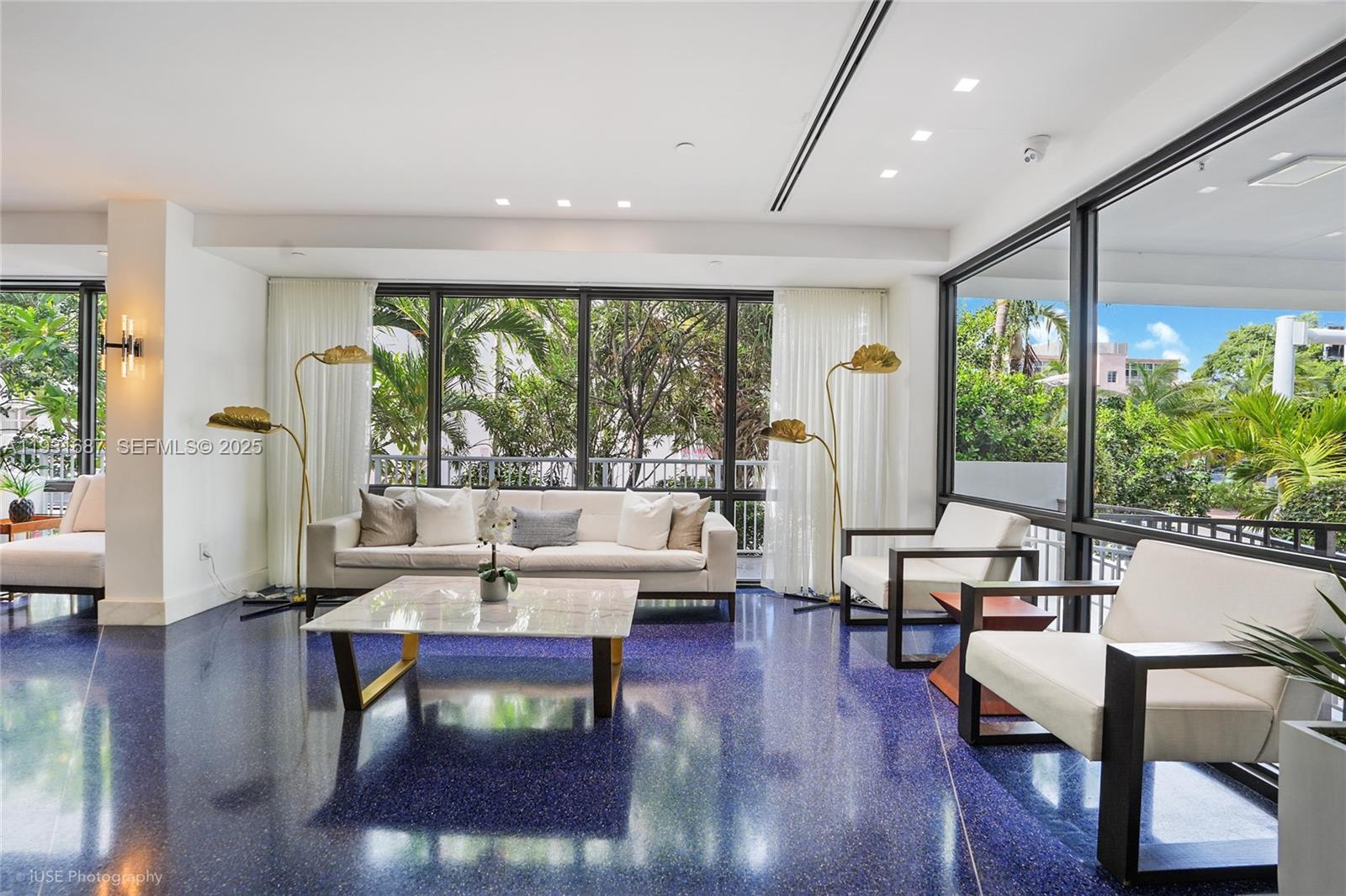 4301 Collins Avenue, Unit 803 Miami Beach, FL 33140 - Photo 3 of 25 a living room with furniture and a large window