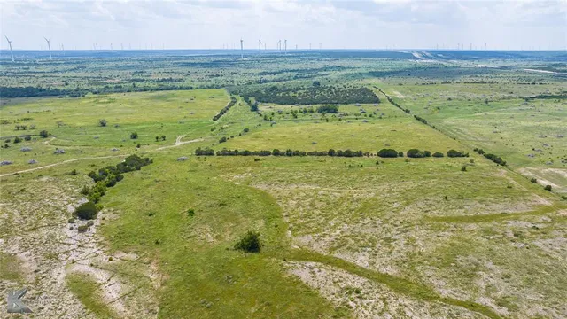 a kitchen with kitchen island granite countertop a sink and stove